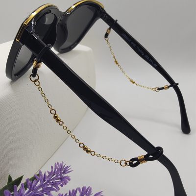 Bijoux de branches - Double duos de perles dorées - Présentation sur lunettes