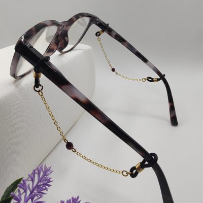 Bijoux de branches - Perle de Grenat - Présentation sur lunettes